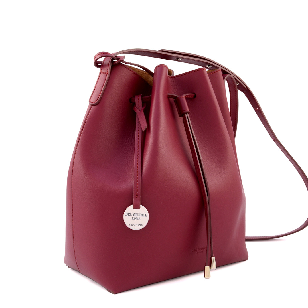 large bucket bag with drawstring closure and shoulder strap