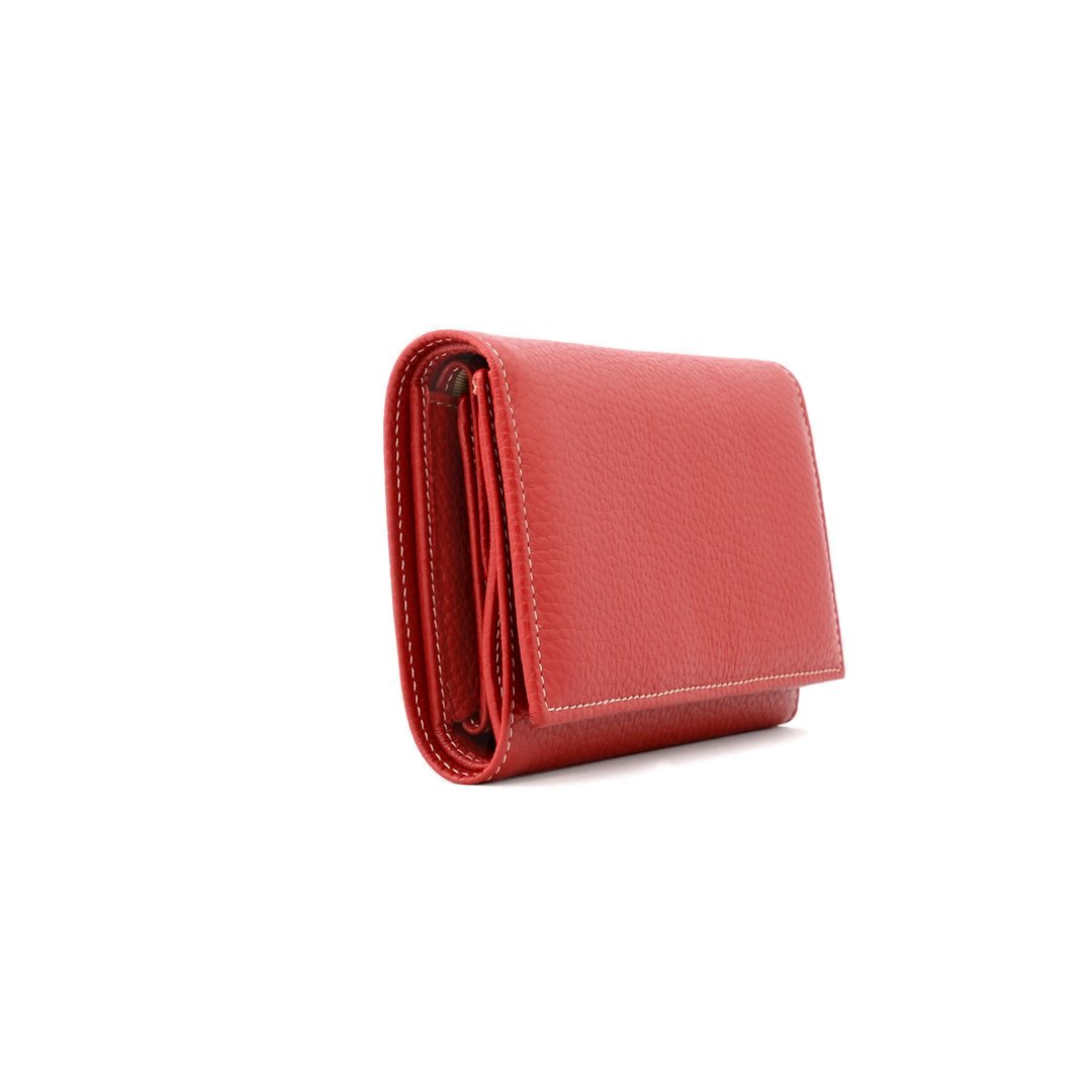 Side view of closed red trifold leather wallet