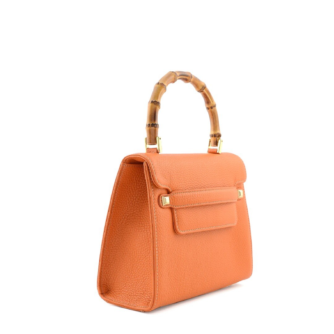leather bag with bamboo top handle