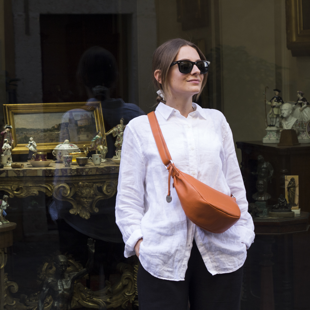 woman wearing crescent crossbody bag